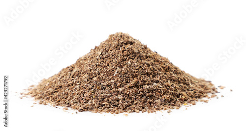 Heap of ground coriander on a white background. Isolated