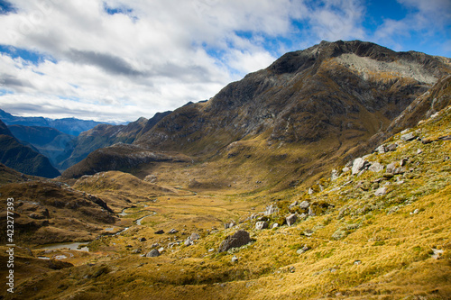 A rocky trail above Lake Harris on day two of the Routeburn Trak (designated as a Great Walk category) in New Zealand's South Island near the town of Glenorchy.  photo