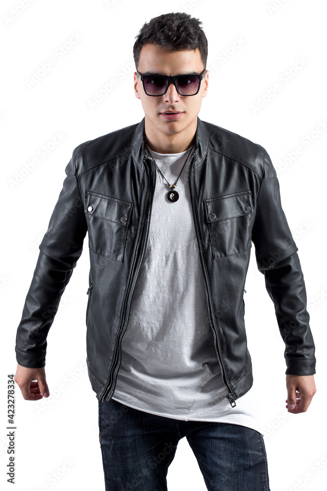 Fototapeta premium Fashion portrait of young handsome man. Cool rap dj, electro house music, deep house, mens fashion style,black style, leather jacket, rap, cat, b-boy, freestyler, singer, talented rap singer