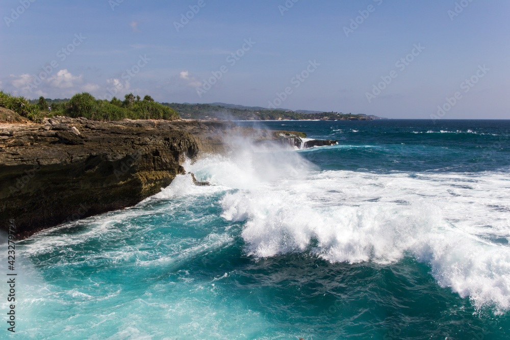 Rough sea and powerful waves hitting rocks INdonesia, Nusa Lembongan