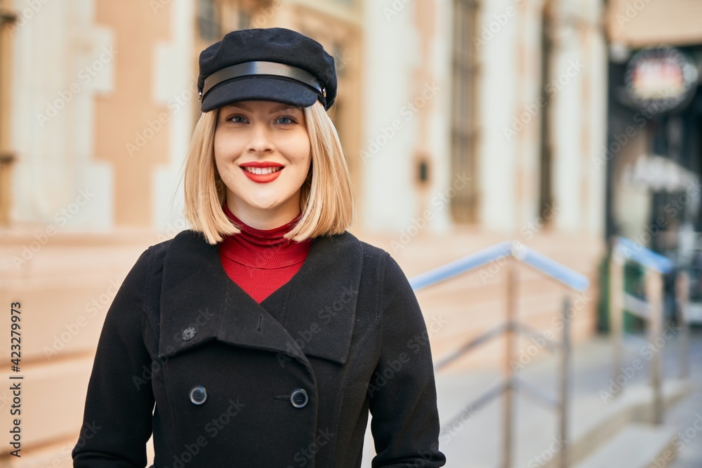 Young blonde woman smiling happy standing at the city. Young blonde woman smiling happy standing at the city.