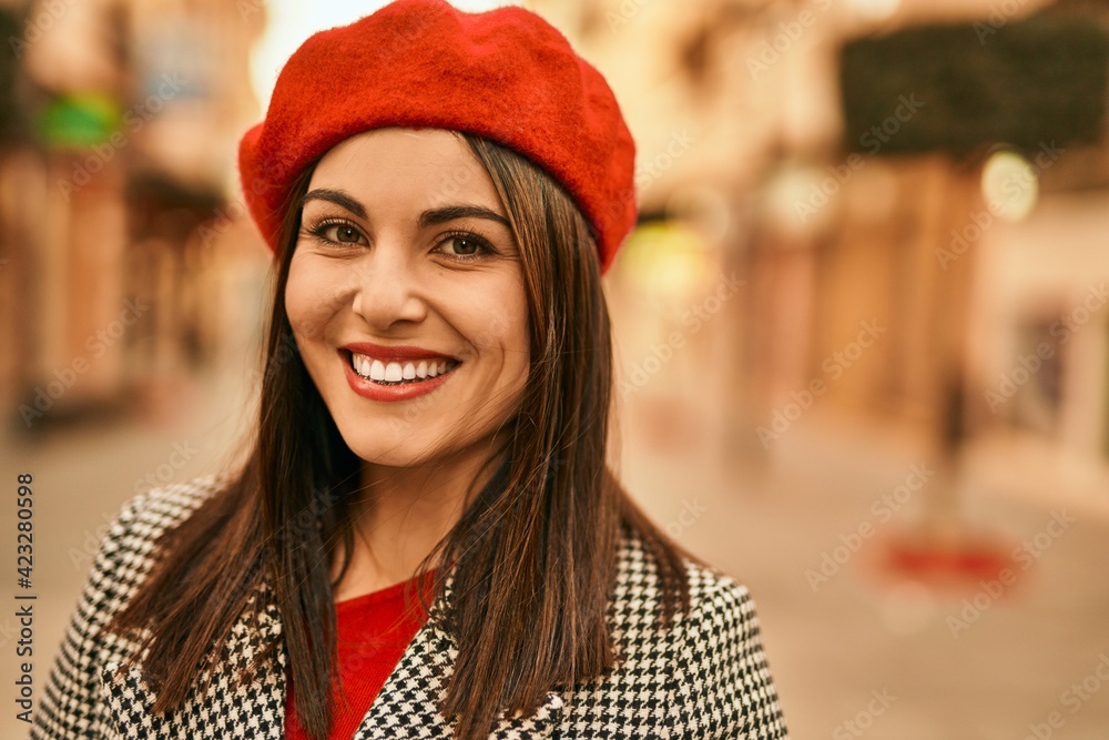 Young hispanic woman smiling happy standing at the city. Young hispanic woman smiling happy standing at the city.