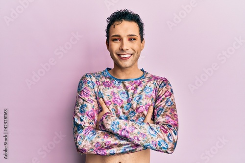Handsome man wearing make up wearing fashion clothes happy face smiling with crossed arms looking at the camera. positive person. photo