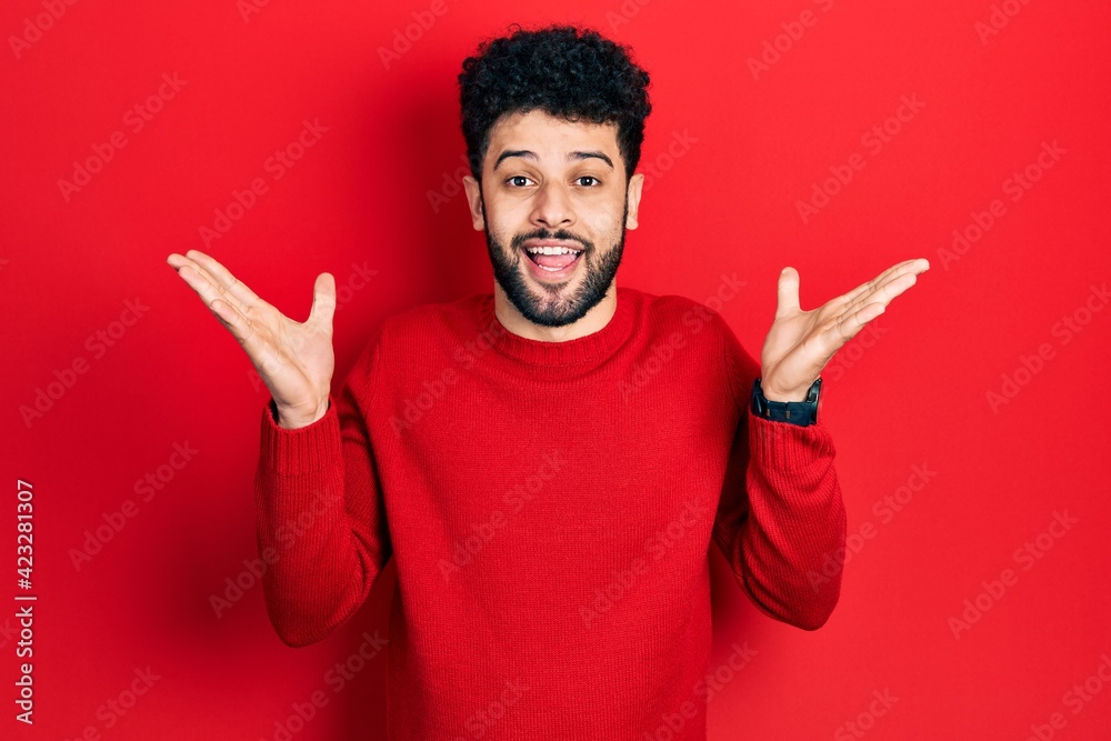 © Krakenimages.com - Young arab man with beard wearing casual red sweater celebrating crazy and amazed for success with arms raised and open eyes screaming excited. winner concept © Krakenimages.com - Young arab man with beard wearing casual red sweater celebrating crazy and amazed for success with arms raised and open eyes screaming excited. winner concept