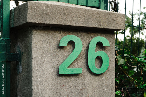 Number 26 in green color