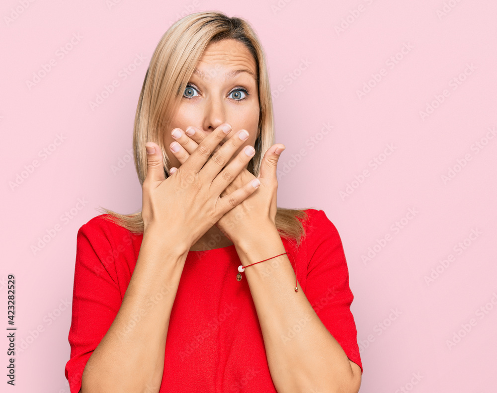 Middle age caucasian woman wearing casual clothes shocked covering mouth with hands for mistake. secret concept. Middle age caucasian woman wearing casual clothes shocked covering mouth with hands for mistake. secret concept.