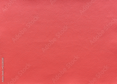 The surface texture of pink leather, background.