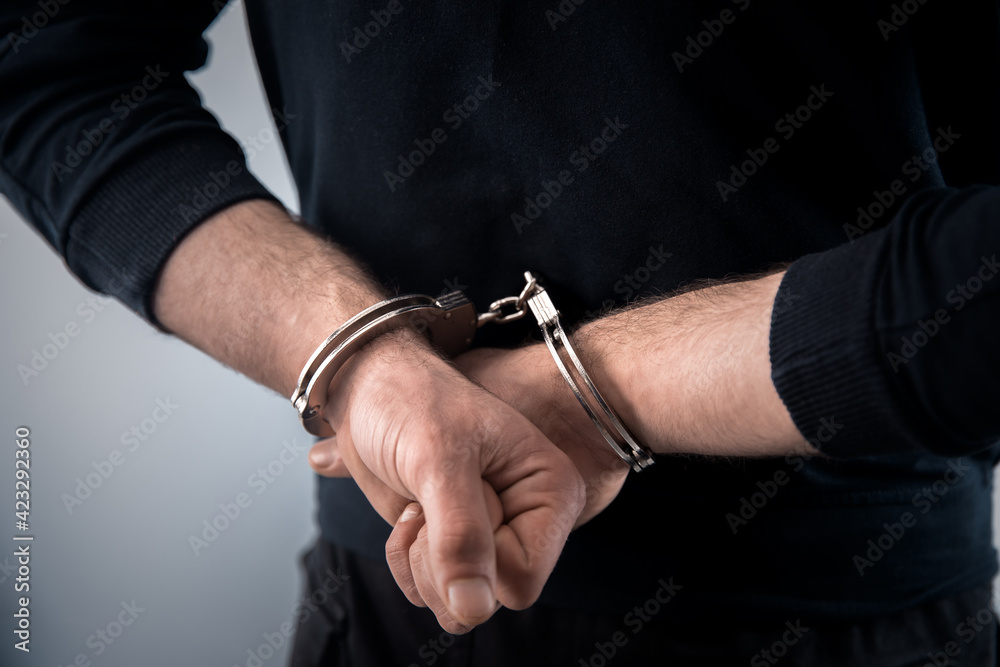 man hand handcuffs man hand handcuffs