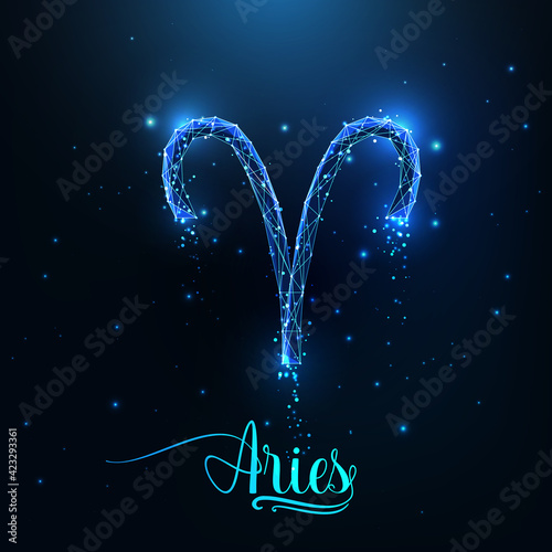 Futuristic glowing low polygonal Aries zodiac sign concept on dark blue background. photo