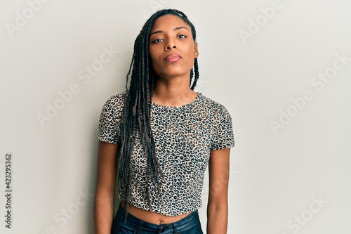 African american woman wearing casual clothes relaxed with serious expression on face. simple and natural looking at the camera.