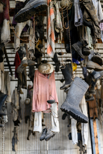 Mining clothes hung in a chain hook locker room.