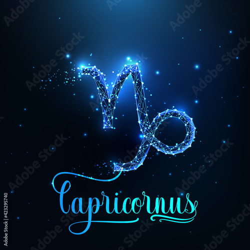 Futuristic glowing low polygonal Capricorn zodiac sign concept on dark blue background.