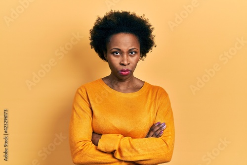 Young african american woman wearing casual clothes skeptic and nervous, disapproving expression on face with crossed arms. negative person. © Krakenimages.com