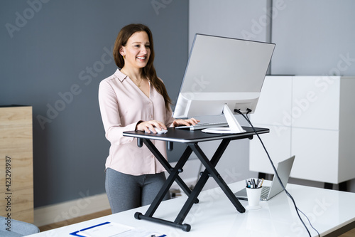 Adjustable Height Desk Stand In Office photo