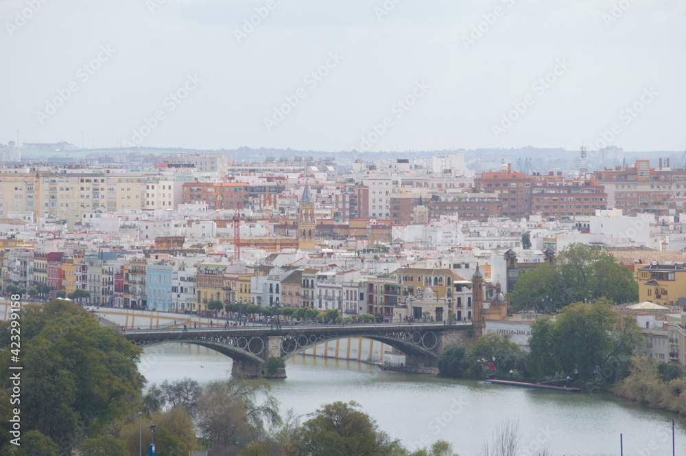 Fototapeta premium Aerial view of Triana an the river Guadalquivir, Seville, Spain