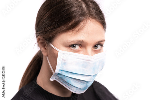 Beautiful young woman posing with mask 