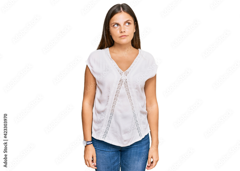 Obraz premium Young caucasian woman wearing casual clothes smiling looking to the side and staring away thinking.