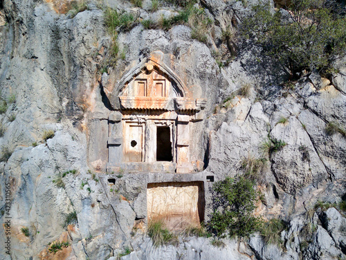 High angle drone aerial view of ancient greek rock cut lykian empire amphitheatre and tombs in Myra (Demre, Turkey) photo