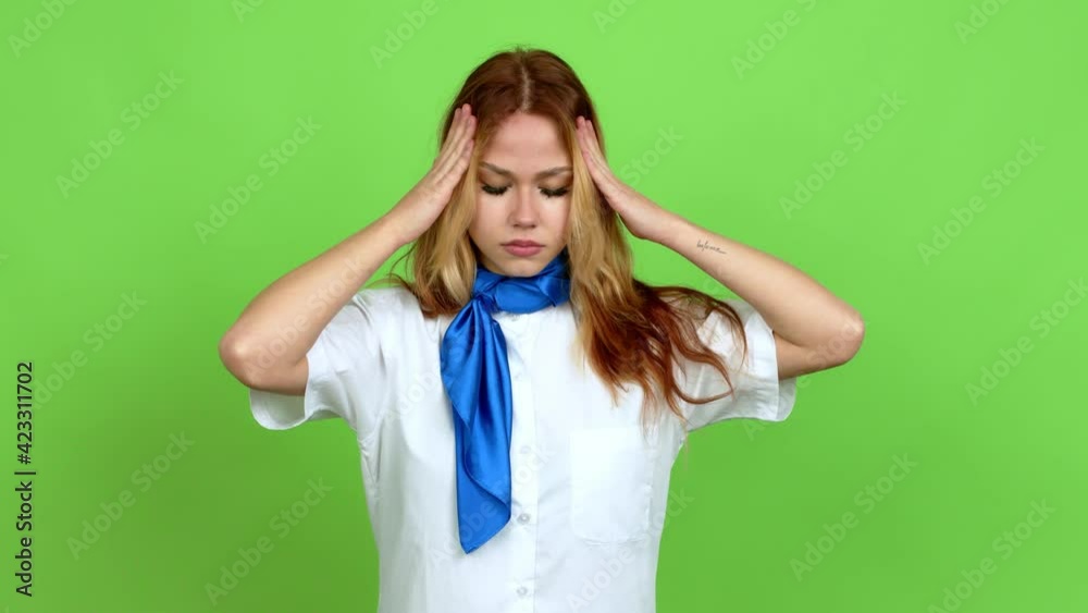 Young blonde teenager girl with stewardess uniform unhappy and frustrated with something over isolated background. Green screen chroma key Young blonde teenager girl with stewardess uniform unhappy and frustrated with something over isolated background. Green screen chroma key
