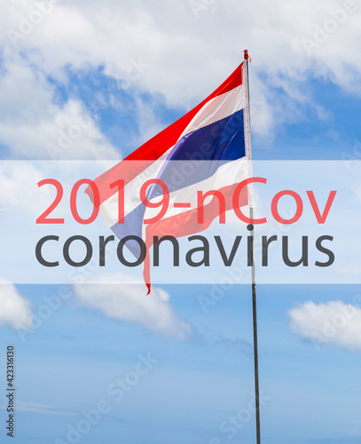 covid 19 coronavirus against the background of the flag of Thailand and blue sky vertical photo