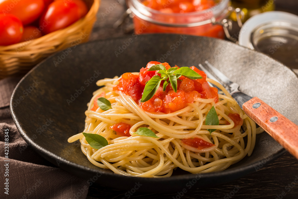 Spaghetti with tomato sauce and basil. Spaghetti with tomato sauce and basil.