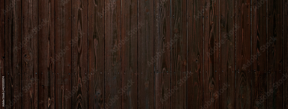 Naklejka premium ダークな色調の木のボードの背景テクスチャー
