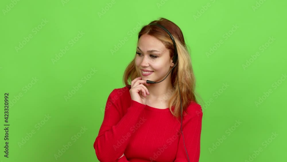 Young blonde teenager girl telemarketer standing and looking to the side over isolated background. Green screen chroma key Young blonde teenager girl telemarketer standing and looking to the side over isolated background. Green screen chroma key