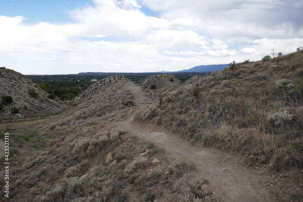 Dirt hiking trail through dry mountainous terrain