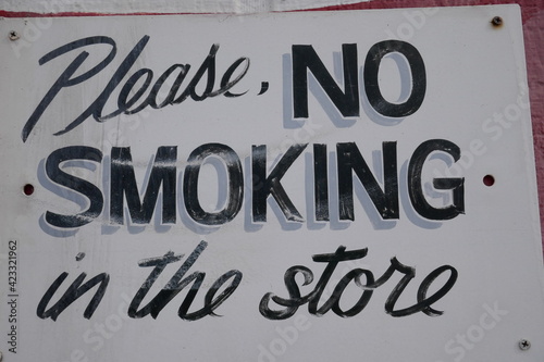 Vintage no smoking in the store sign