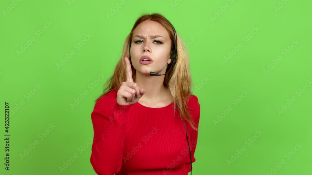 Young blonde teenager girl telemarketer doing silence gesture over isolated background. Green screen chroma key Young blonde teenager girl telemarketer doing silence gesture over isolated background. Green screen chroma key