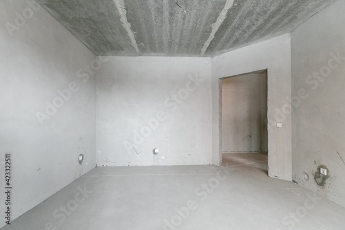 interior of the apartment without decoration in gray colors. rough finish