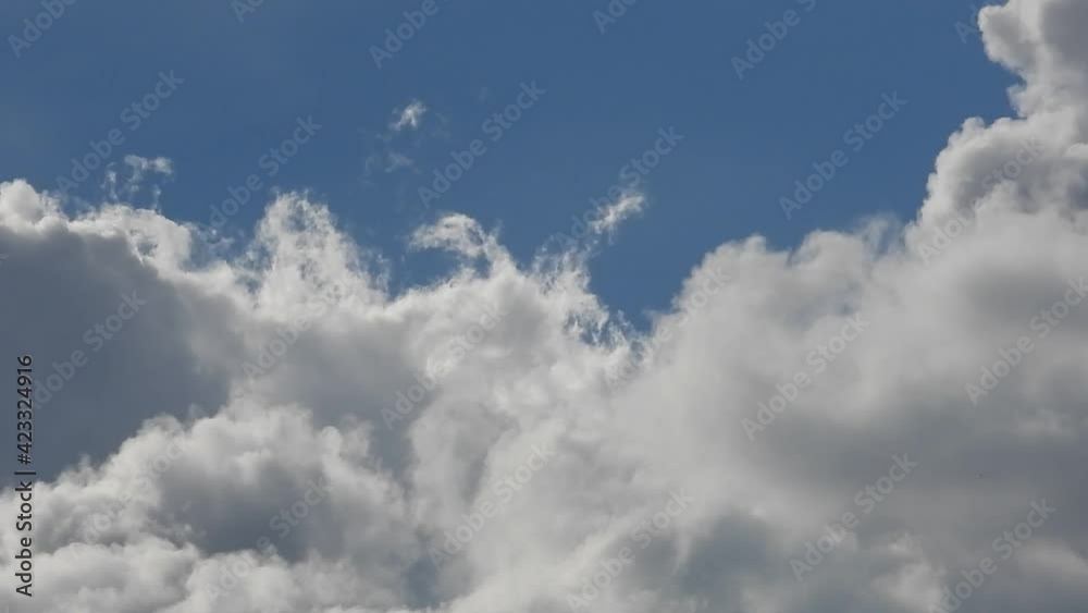 Fluffy cumulus clouds in blue sky Fluffy cumulus clouds in blue sky