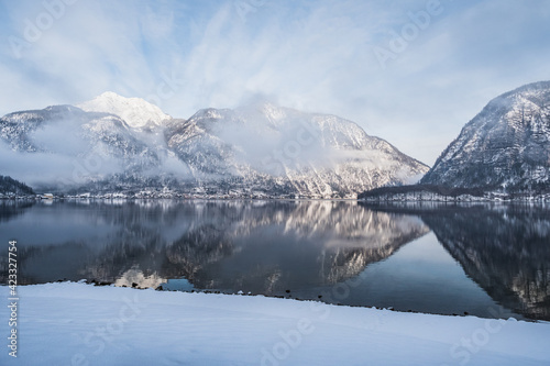 Lake Hallstatt or Hallstatter See in Winter in the Salzkammergut, Upper Austria , with Snow Covered Mountains on a Cold January Morning