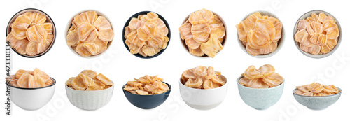 Set with sweet dried jackfruit slices in bowls on white background. Banner design