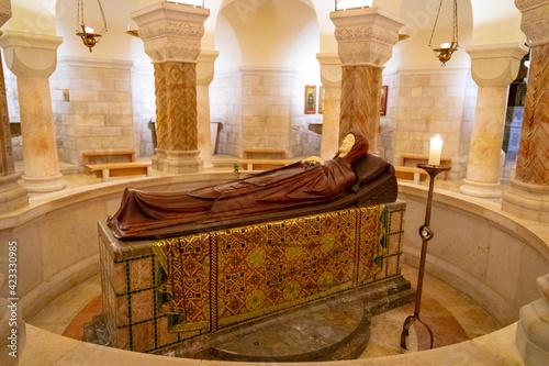 Life-size statue of Mary in death made of cherry wood and ivory inside of Dormition Abbey - church on the site where the Virgin Mary is said to have died.
JERUSALEM, ISRAEL - march 2021 photo