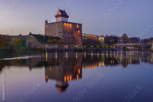View of the Herman Castle in the lilac October twilight. Narva, Estonia