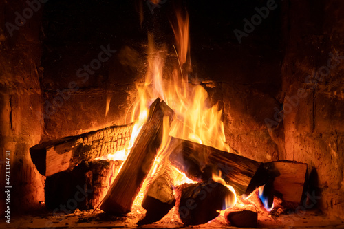 A fire burns in a fireplace  Fire to keep warm. Winter time