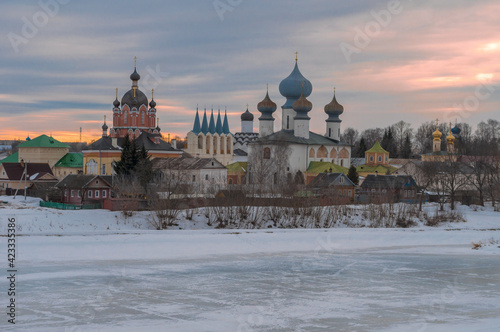 View of the Tikhvin Assumption Monastery on a cloudy March evening. Leningrad region, Russia