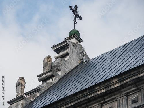 LVIV, UKRAINE - March 2021: Exterior of The Bernardine church and monastery, today the Greek Catholic church of St. Andrew. Sculptures of monks on the roof.