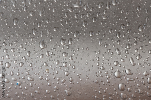 Water droplets on a metal surface. Background image.