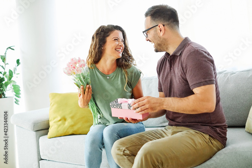 gift woman man couple happy love happiness present  romantic smiling together box girlfriend
