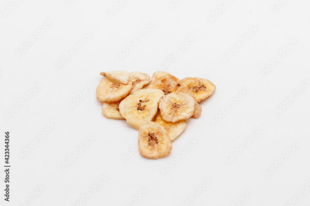 banana chips on white background close up