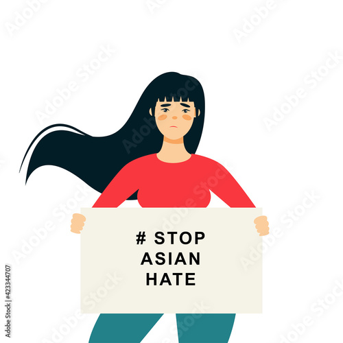 Stop Asian Hate‬‬. Hashtag to support asian community during the covid-19 pandemic. Stop racism. woman wearing protective face mask and holding banner against bullying, hate and violence.