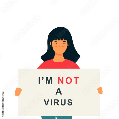 Stop Asian Hate‬‬. Hashtag to support asian community during the covid-19 pandemic. Stop racism. woman wearing protective face mask and holding banner against bullying, hate and violence.