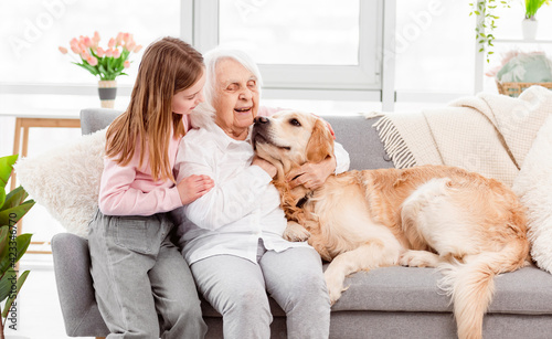 Grandmother with granddaughter and dog © tan4ikk
