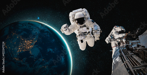 Fototapeta Naklejka Na Ścianę i Meble -  Astronaut spaceman do spacewalk while working for space station in outer space . Astronaut wear full spacesuit for space operation . Elements of this image furnished by NASA space astronaut photos.