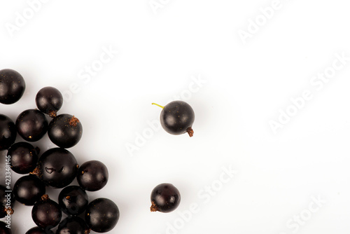 Black currant. Ripe juicy black currant berries isolated on white background