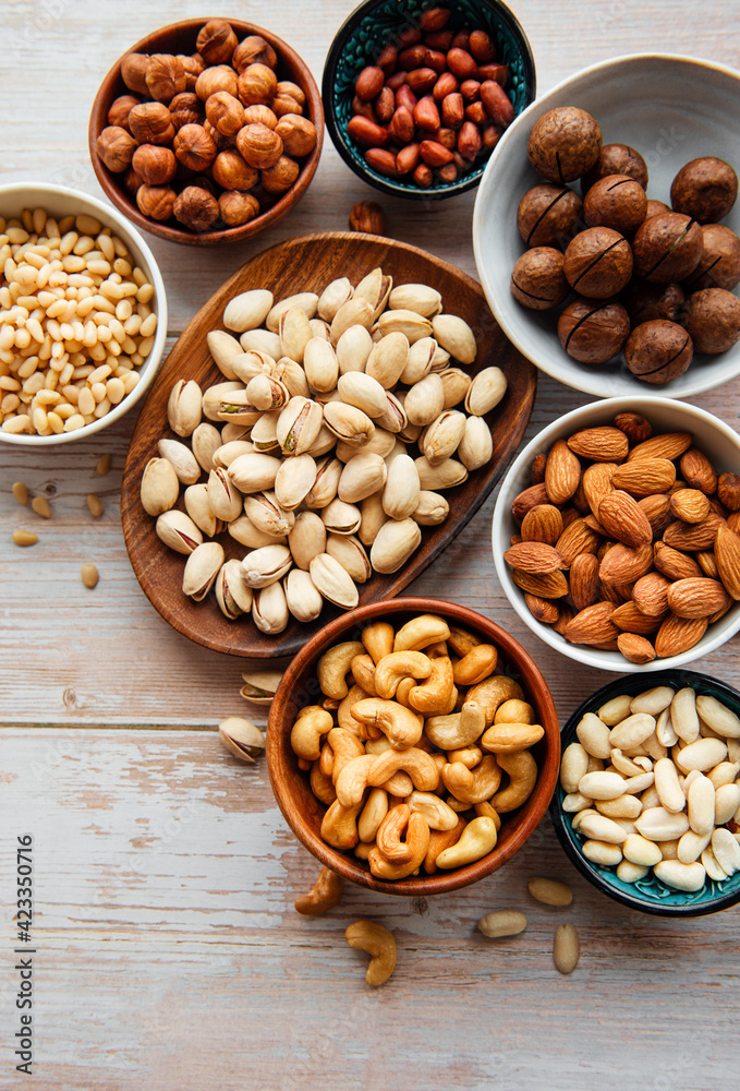 Bowls with various nuts on a table Bowls with various nuts on a table