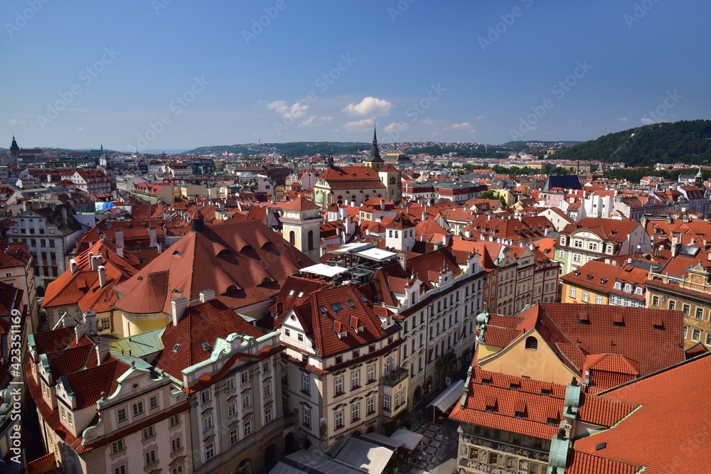 Fototapeta premium Prague is characteristic with its red rooftops, here shown in summer with blue skies, Central Bohemia, Czech Republic.