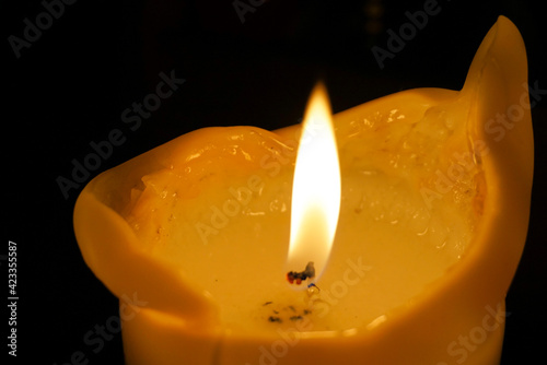 Close up view of a burning candle